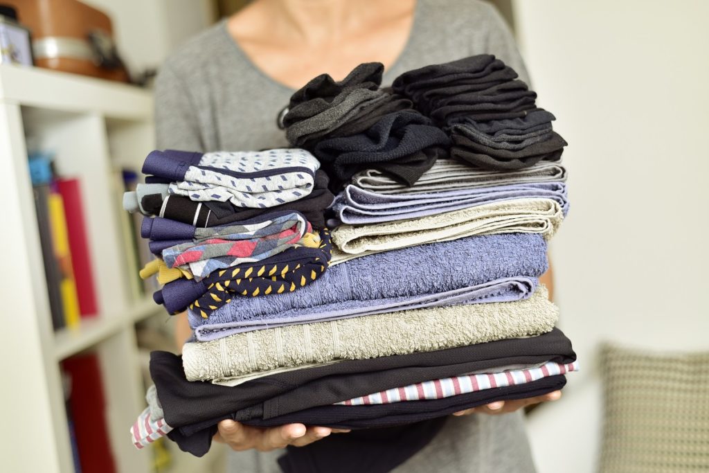 Woman decluttering her clothes