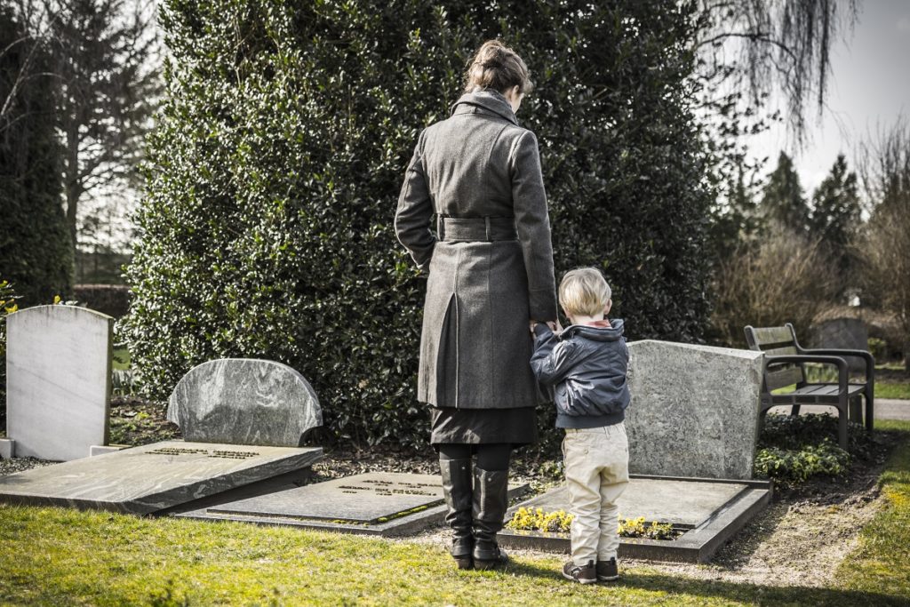 Woman and child at the graveyard