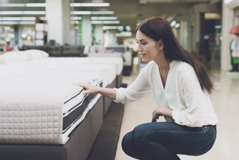 woman shopping for bedding
